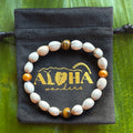 Job’s tears seeds, tigers eye crystals, freshwater champagne pearls, 6.5-7in stretchy bracelet