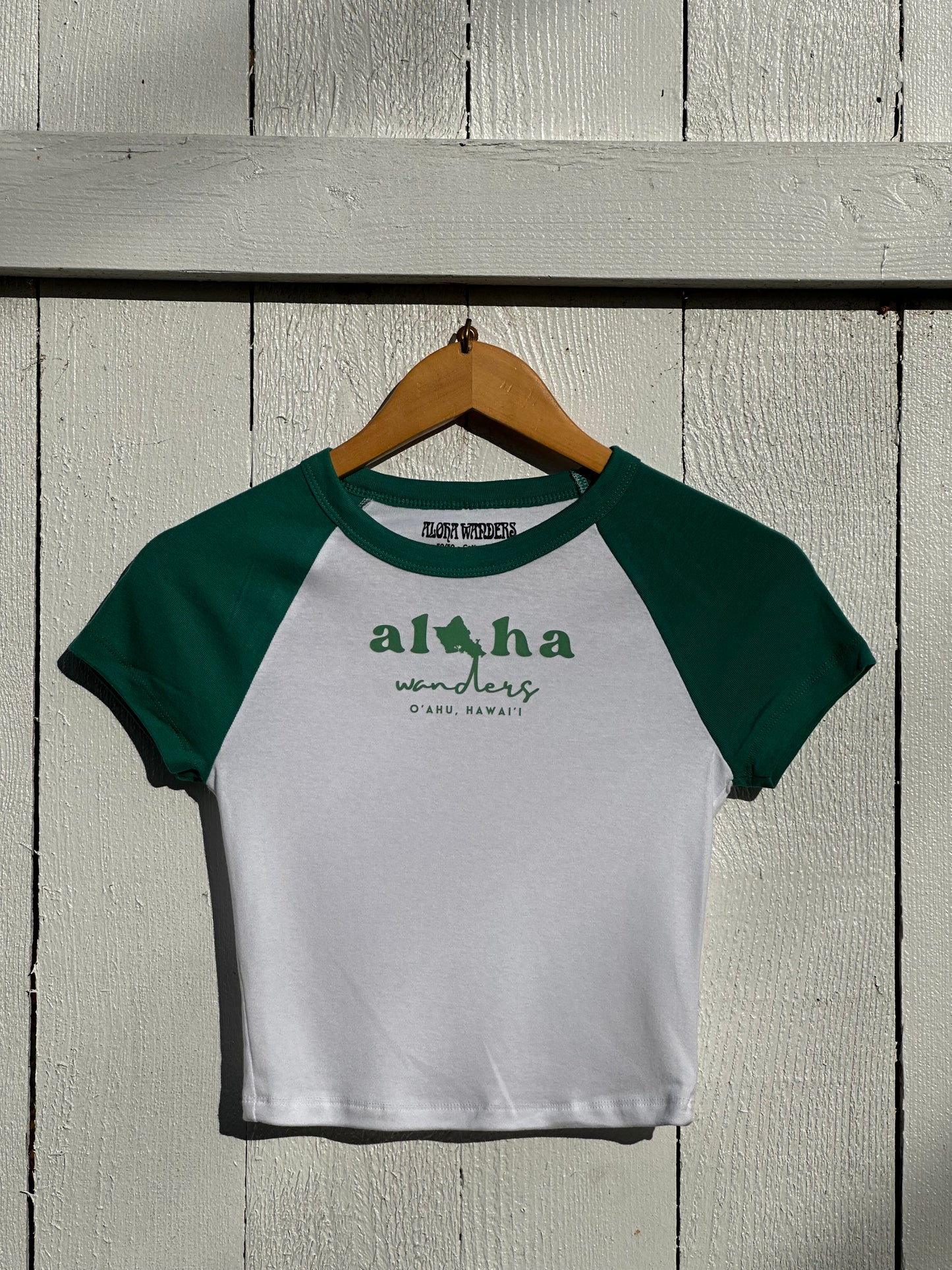 ALOHA WANDERS GREEN RAGLAN BABY TEE